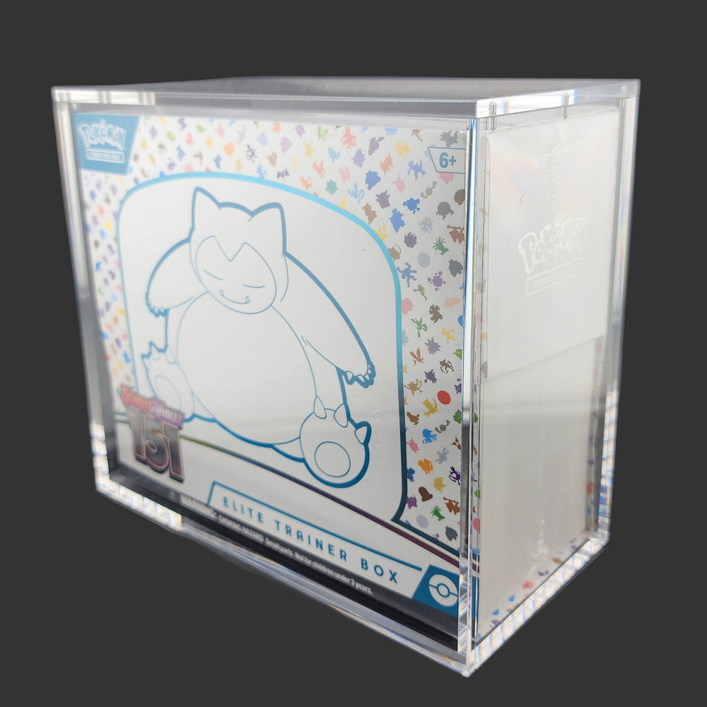 Pokémon Elite Trainer Box with cartoon character design on a dark surface