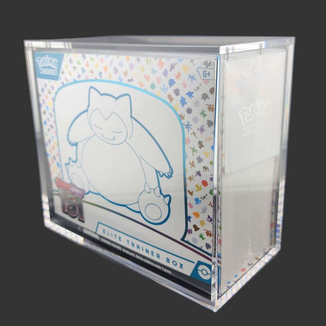 Pokémon Elite Trainer Box with cartoon character design on a dark surface