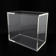 Clear acrylic cube on a black background