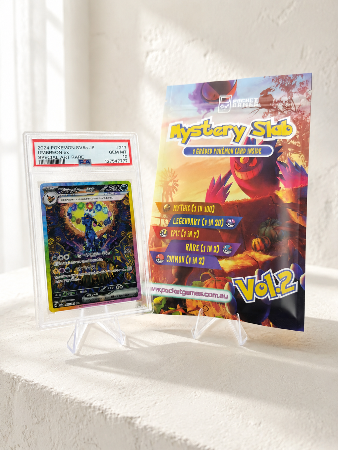 Pokémon trading card with a 'Mystery Skul' trading card pack on a white surface