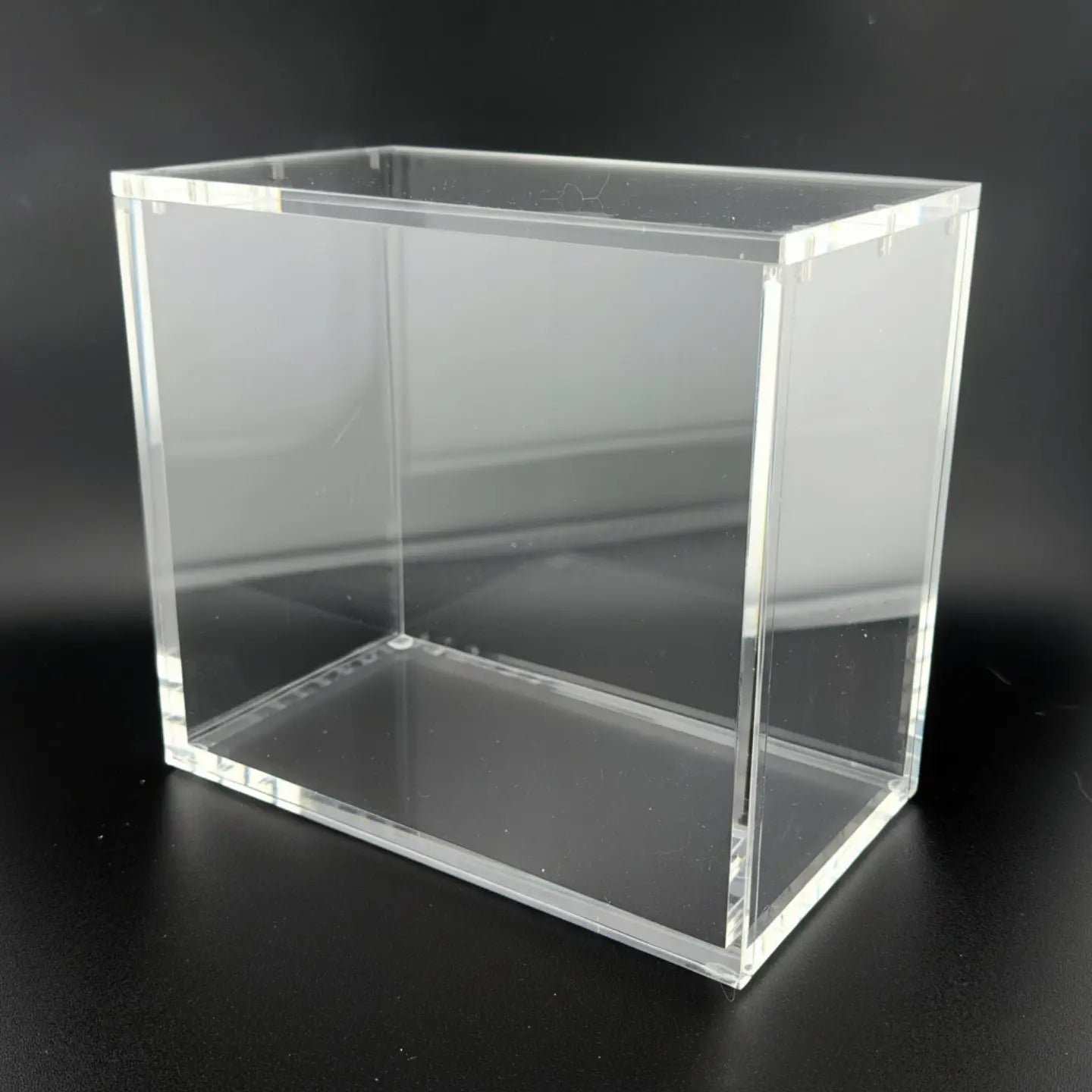 Clear acrylic block on a black background